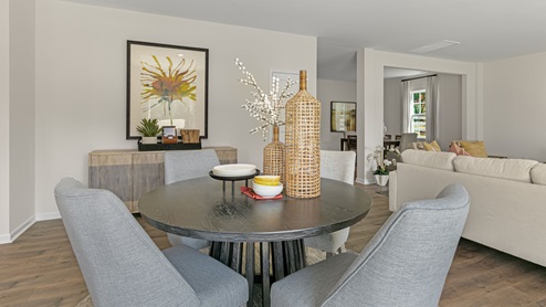 dining area with revwood flooring and ample light