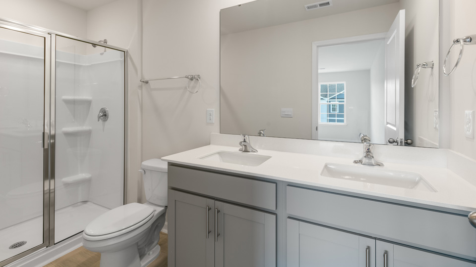 Bathroom with grey cabinets