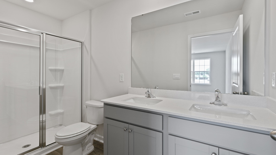 Bathroom with grey cabinets