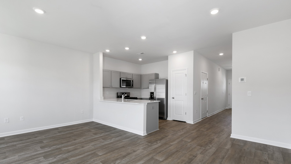 open concept living space with large windows