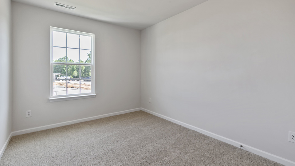 additional bedroom with window, carpeting, closet