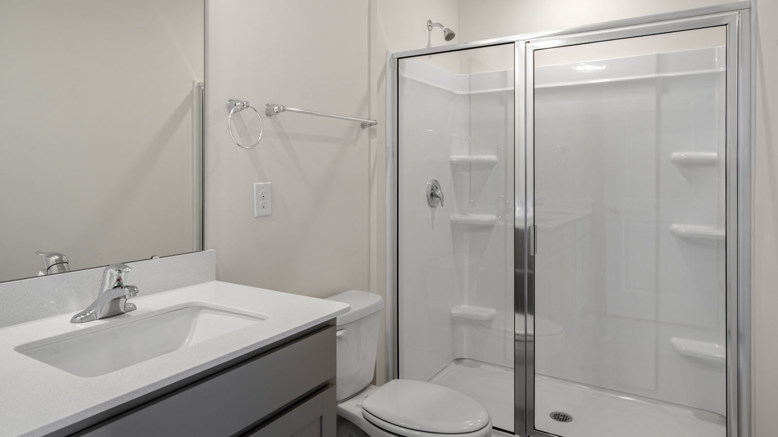 Bathroom with grey cabinets