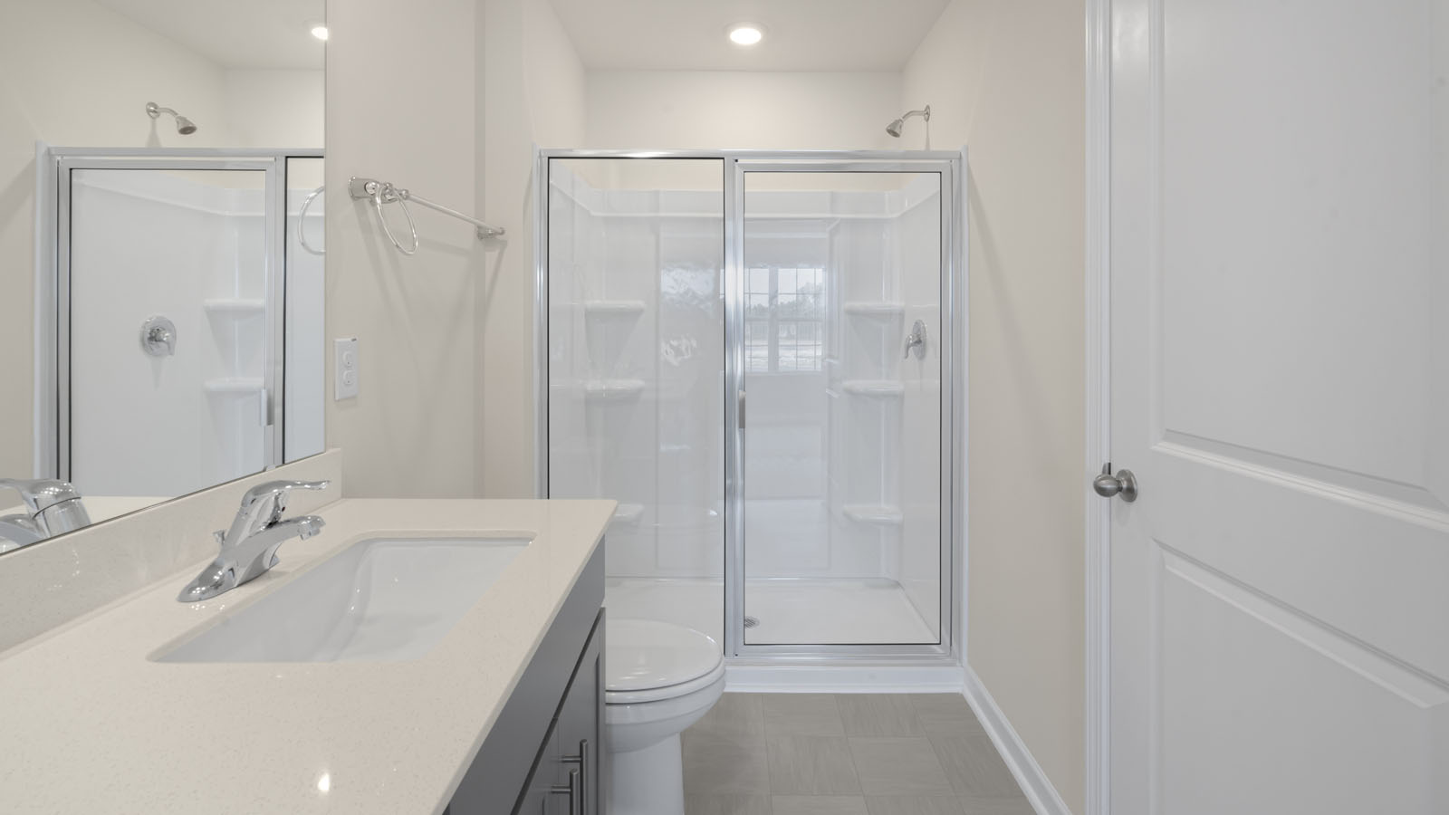 Bathroom with grey cabinets