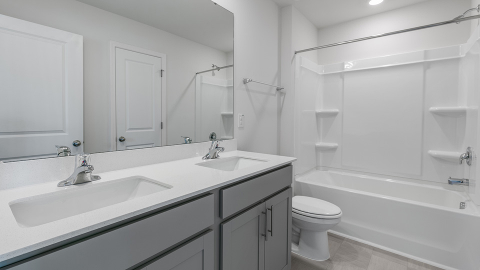 Bathroom with grey cabinets