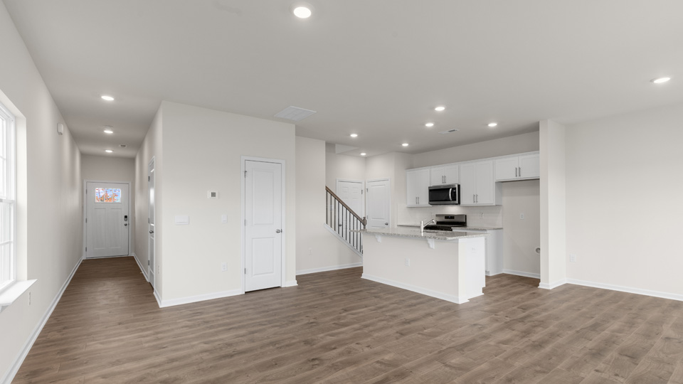 living area with revwood flooring