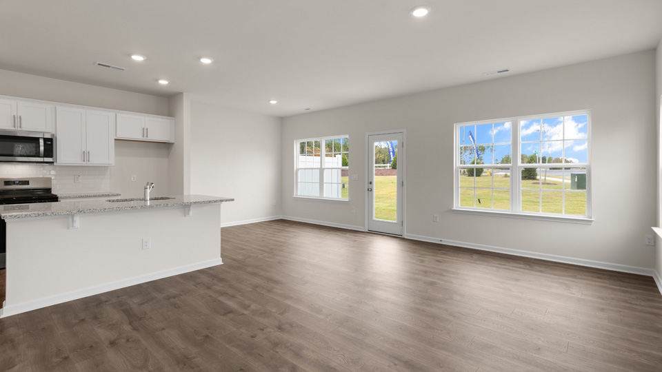living area with revwood flooring