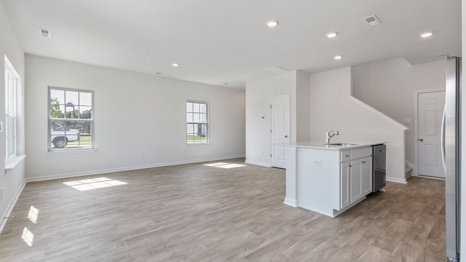 open concept living space with large windows