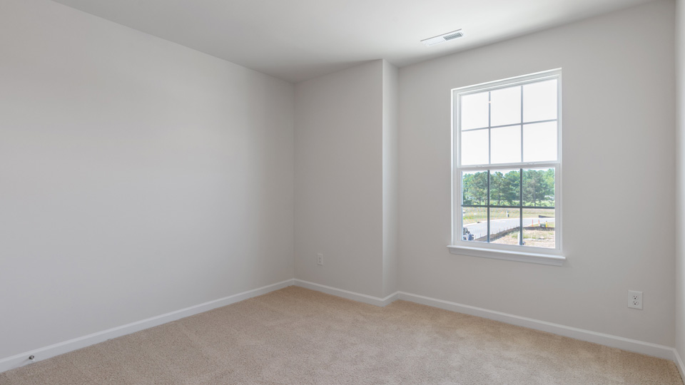 additional bedroom with window, carpeting, closet