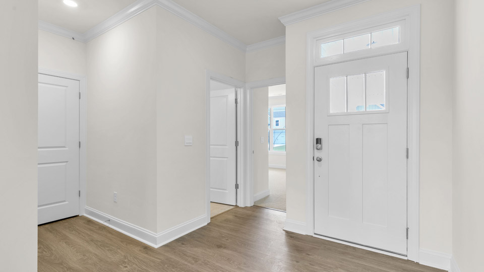 foyer entryway with revwood flooring