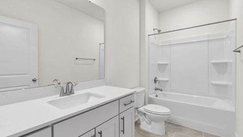 bathroom with quartz countertops