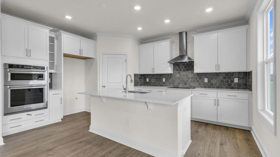 kitchen with white cabinets and quartz countertops