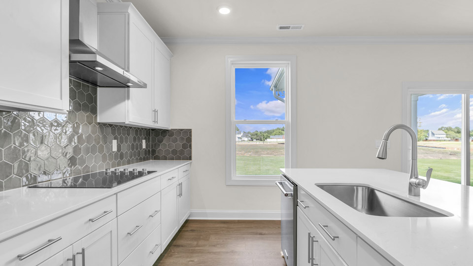kitchen with white cabinets and quartz countertops