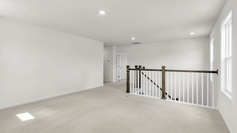 loft with carpet flooring