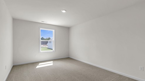 loft with carpet flooring