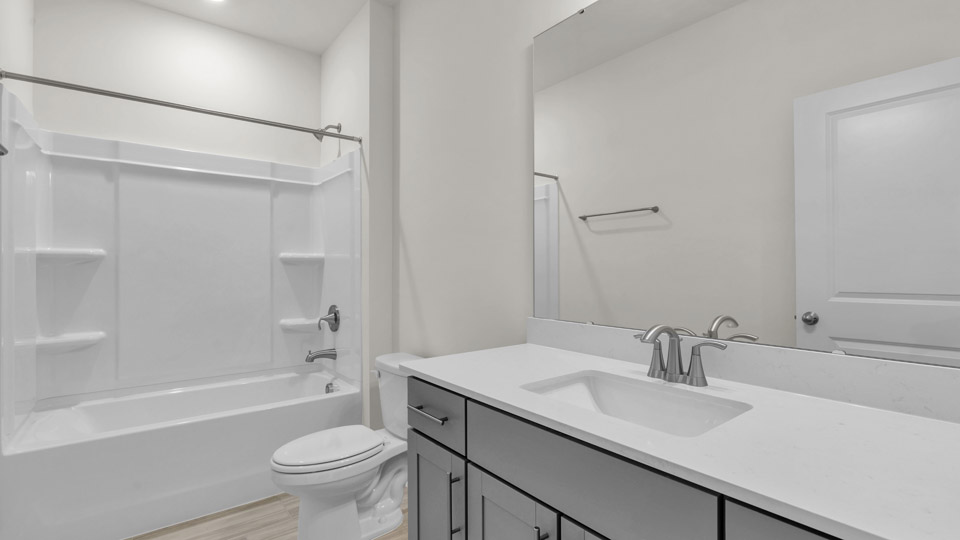 bathroom with quartz countertops