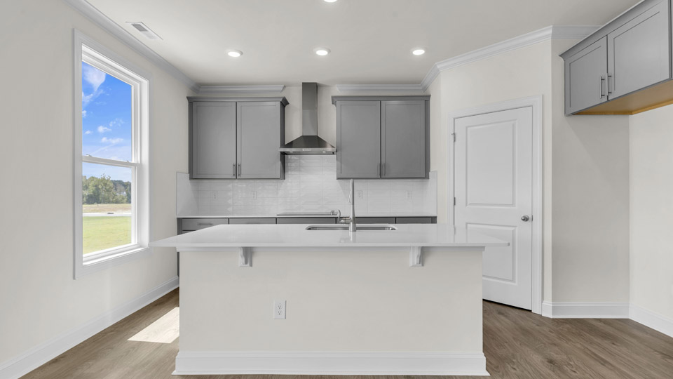 kitchen with gray cabinets and quartz countertops