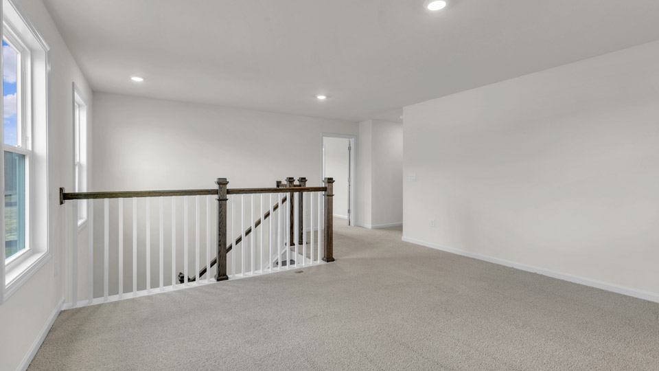 loft with carpet flooring
