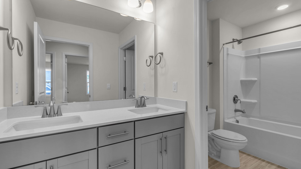 bathroom with separate tub and walk-in shower