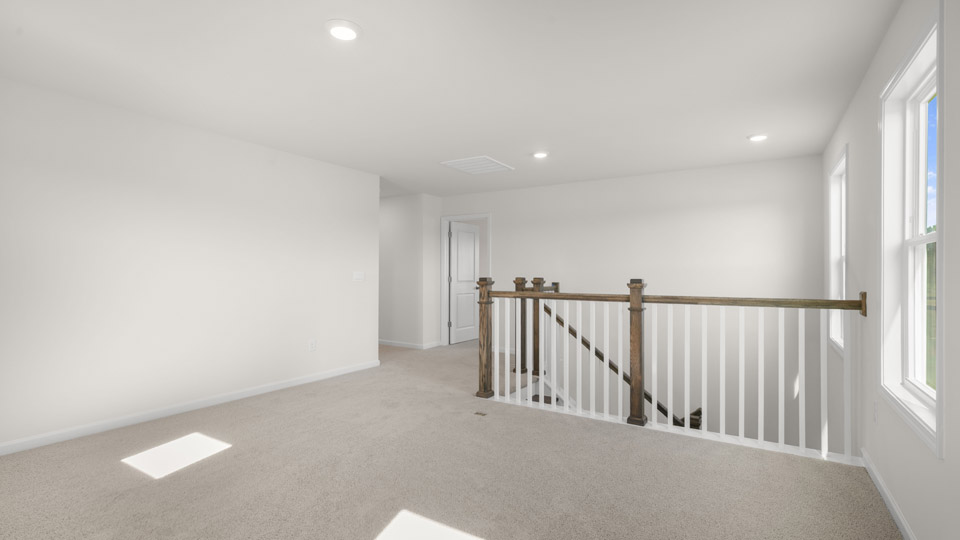 loft with carpet flooring