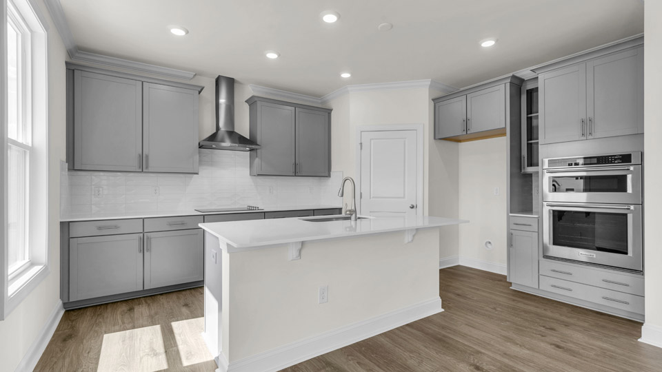 kitchen with gray cabinets and quartz countertops