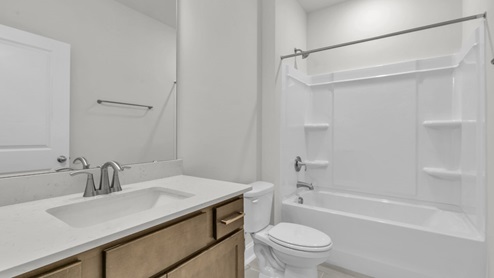bathroom with quartz countertops