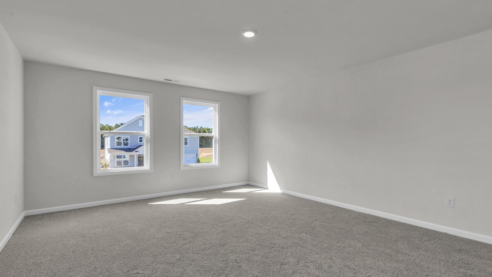 loft with carpet flooring
