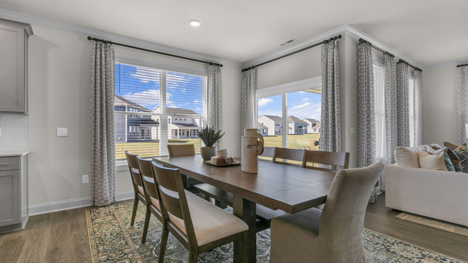 open concept dining space with sliding glass door to patio