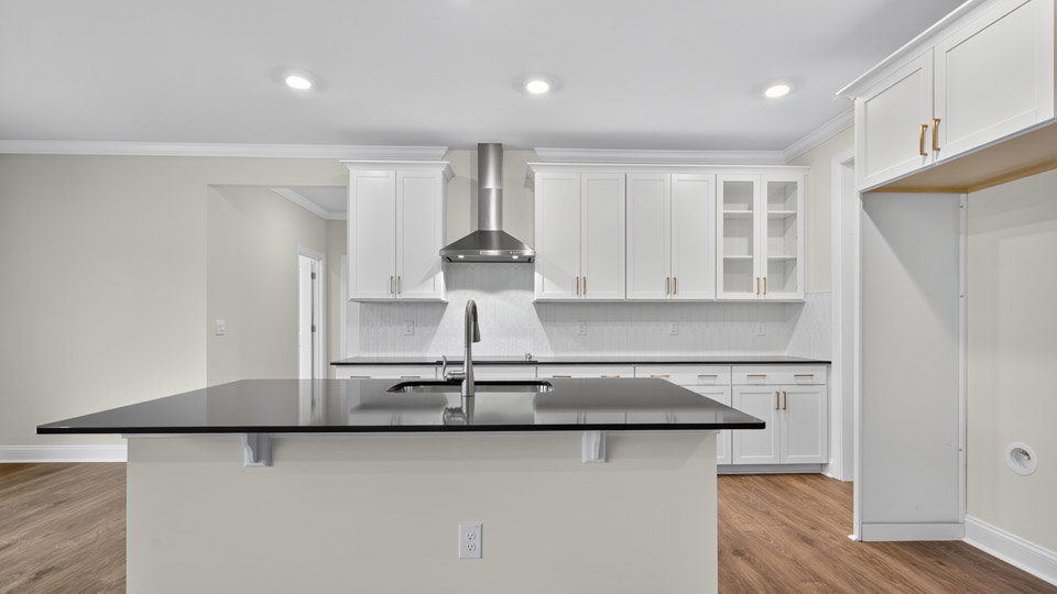 kitchen with white cabinets and quartz countertops