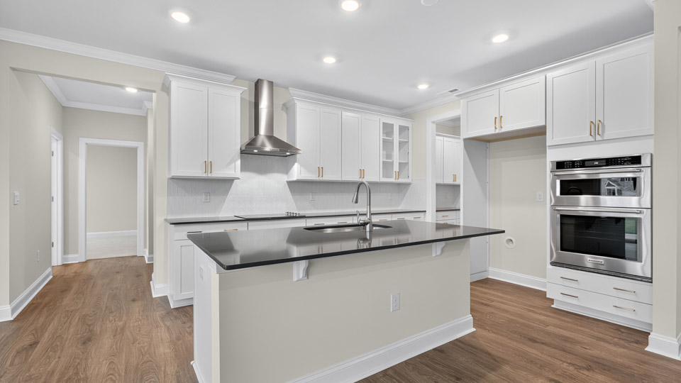 kitchen with white cabinets and quartz countertops