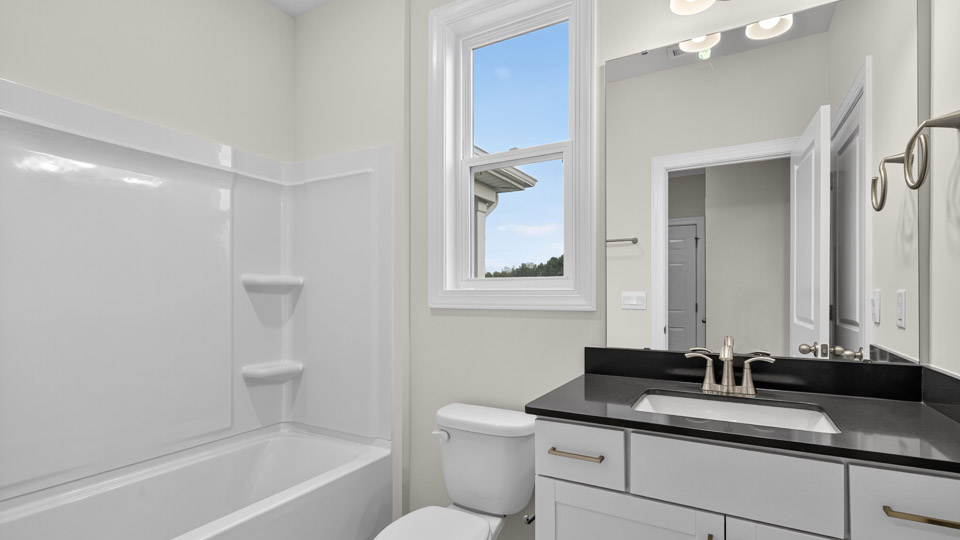 bathroom with quartz countertops