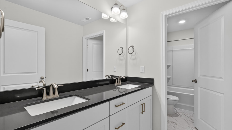 bathroom with quartz countertops