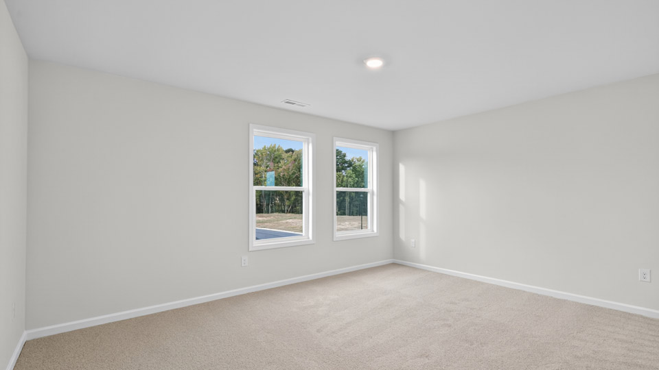 loft with carpet flooring
