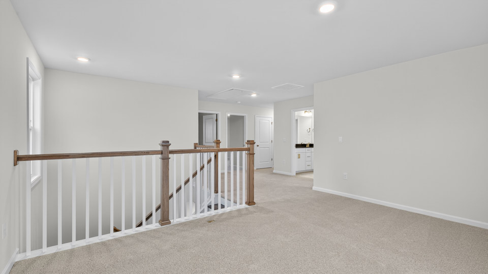loft with carpet flooring