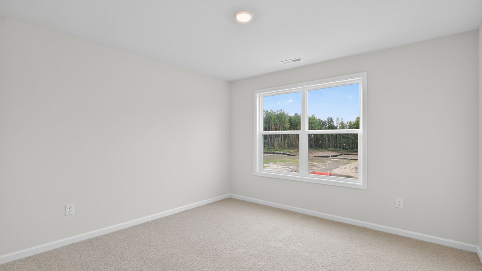 loft with carpet flooring
