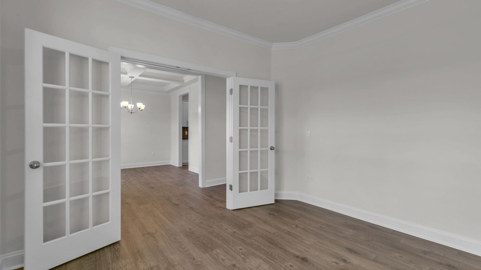 study with revwood flooring and french doors