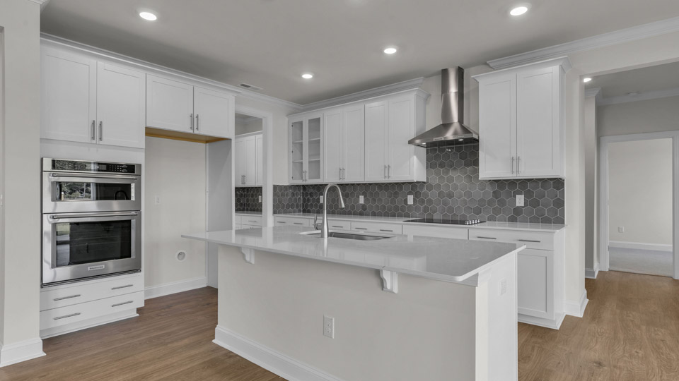 kitchen with white cabinets and quartz countertops