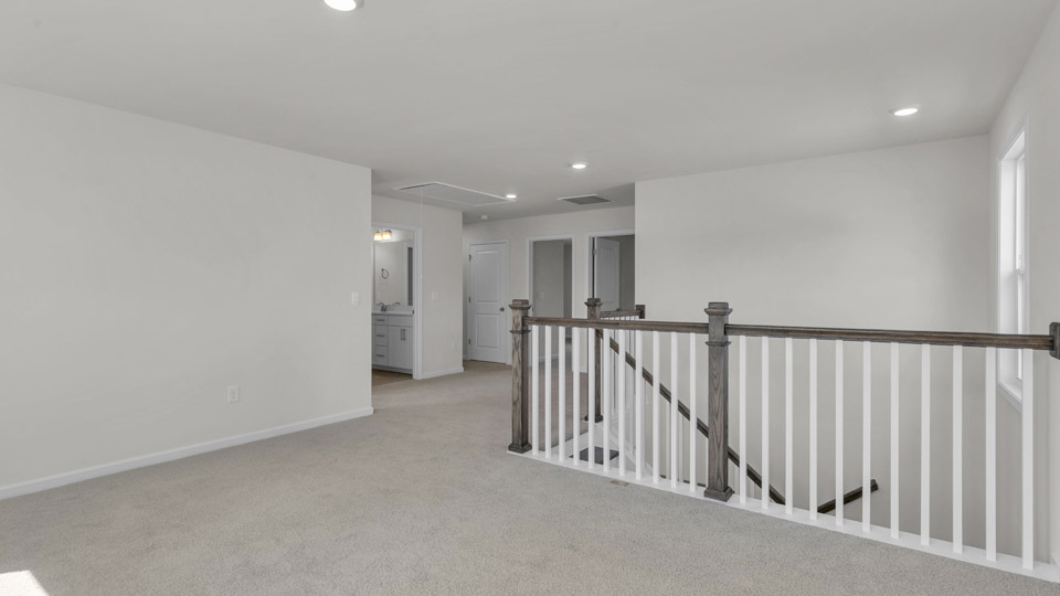 loft with carpet flooring