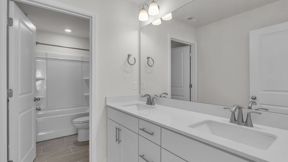 bathroom with quartz countertops