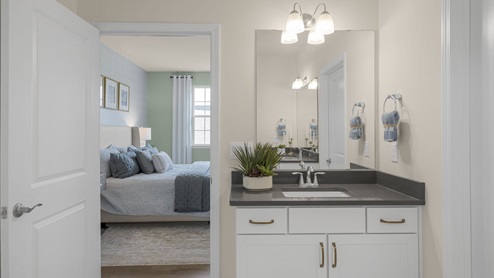 Bathroom with quartz countertop and tub