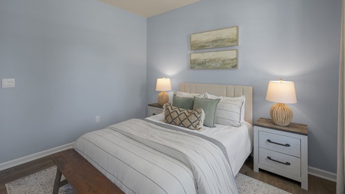 Bedroom with natural lighting and carpet flooring