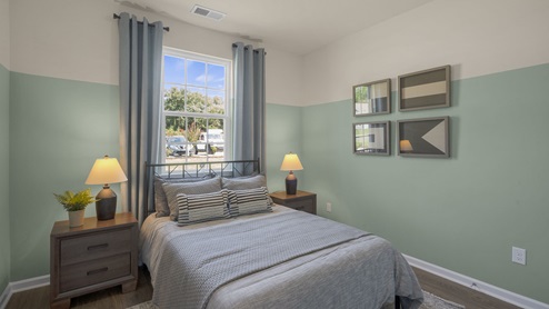 Bedroom with natural lighting and carpet flooring
