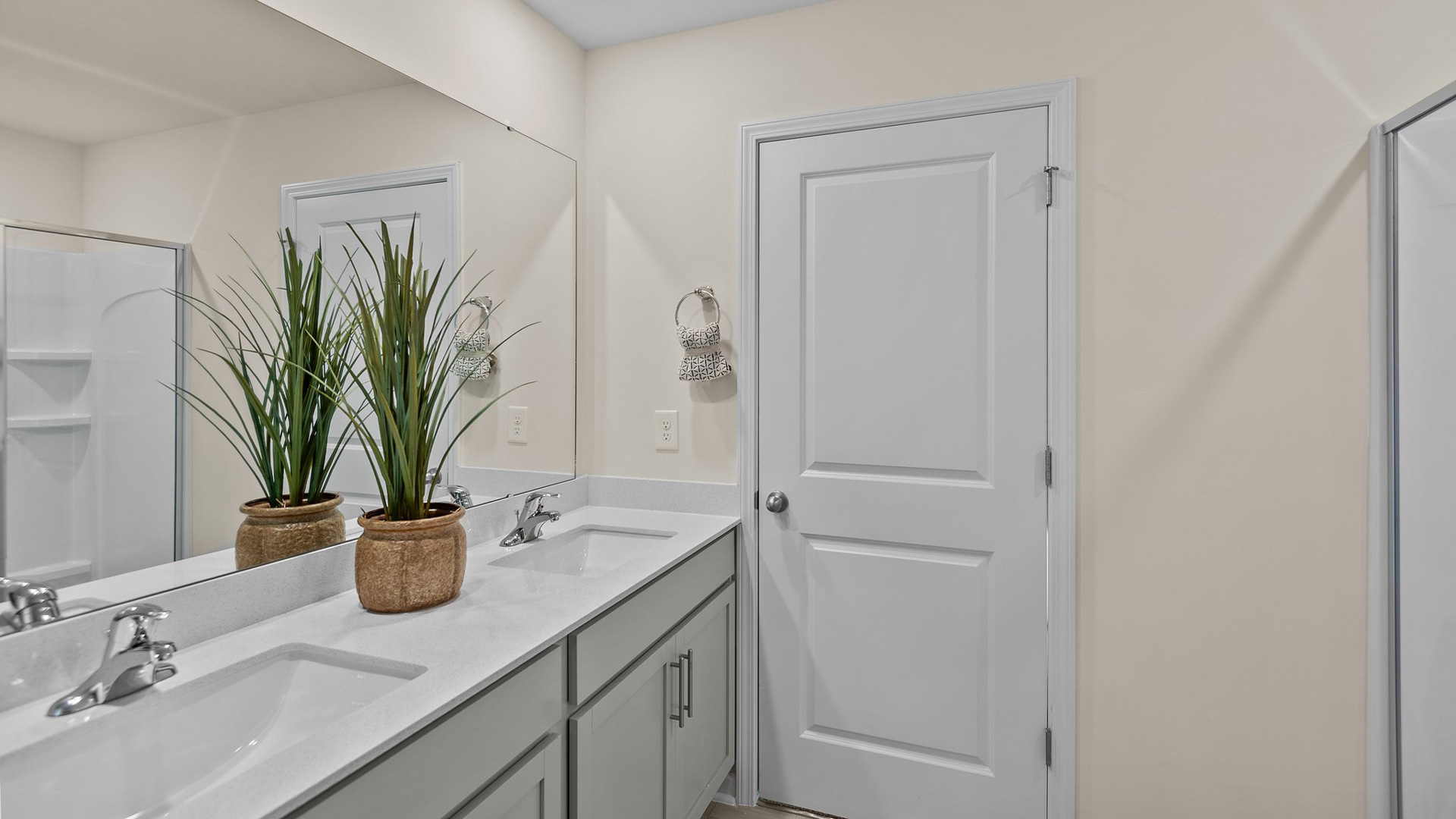 Bathroom with quartz countertops and walk in shower