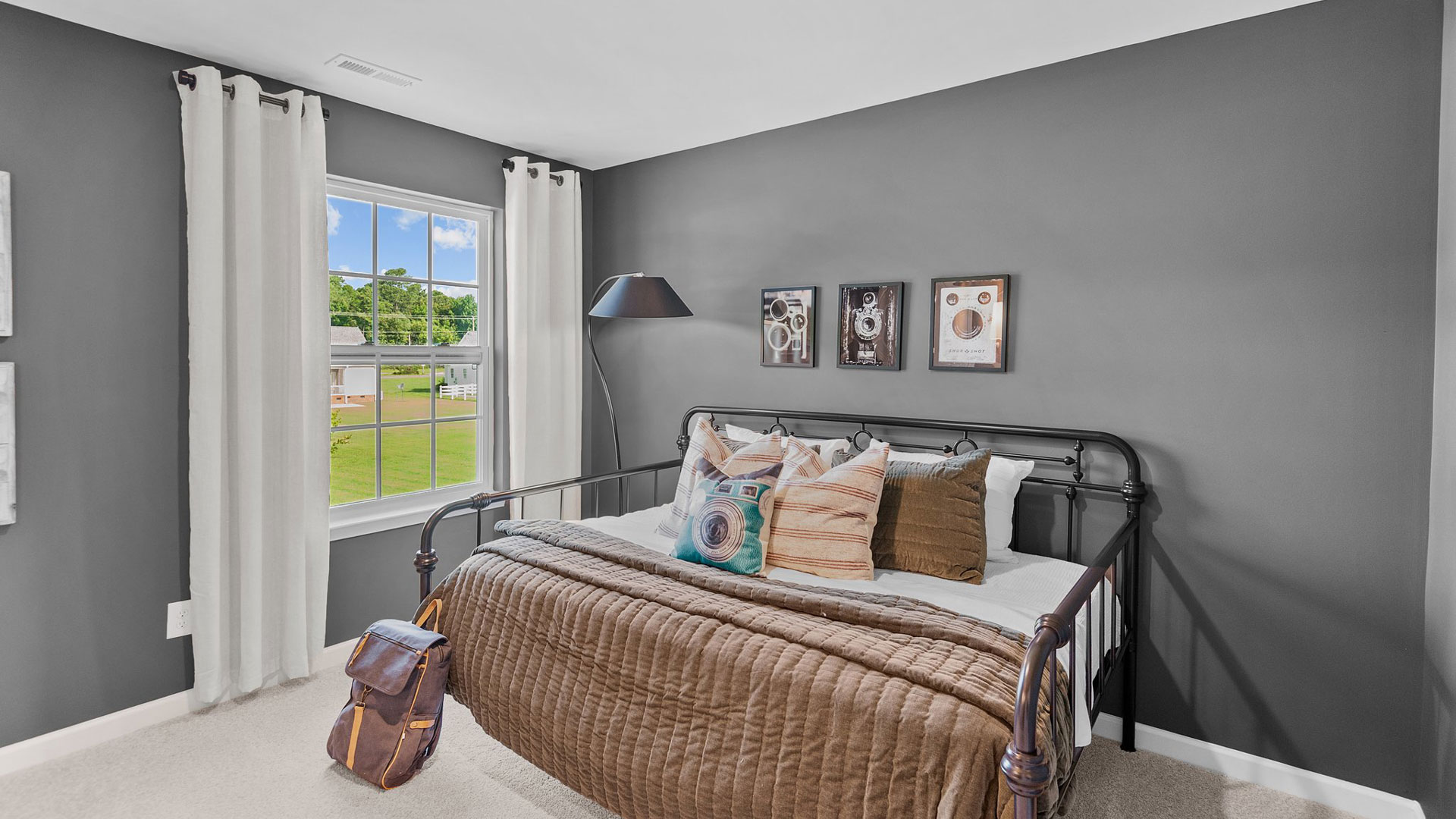 Bedroom with natural lighting and carpet flooring