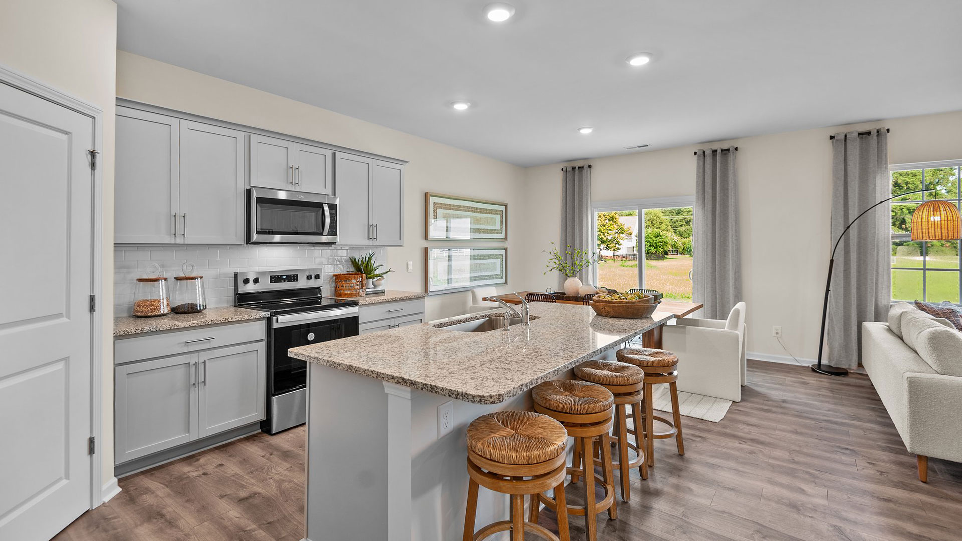 Kicthen with stainless steel appliances and quartz countertops