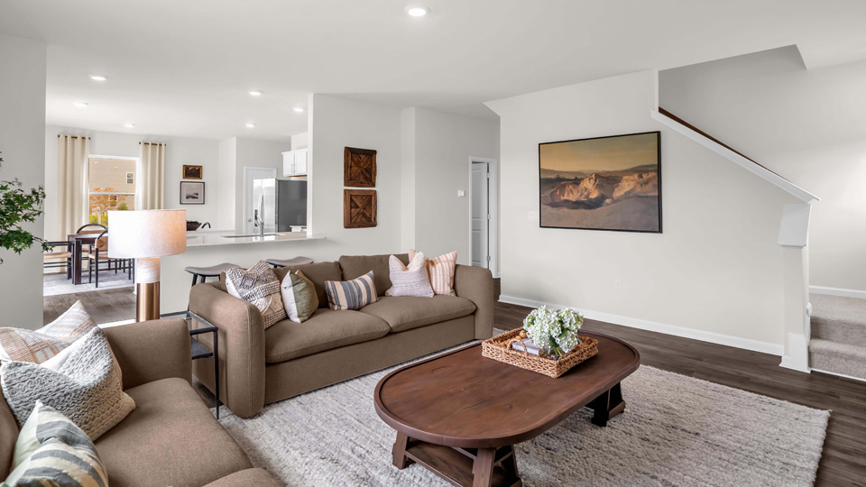 living area with ample lighting and revwood flooring