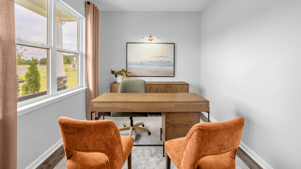 study with ample lighting and revwood flooring and french doors