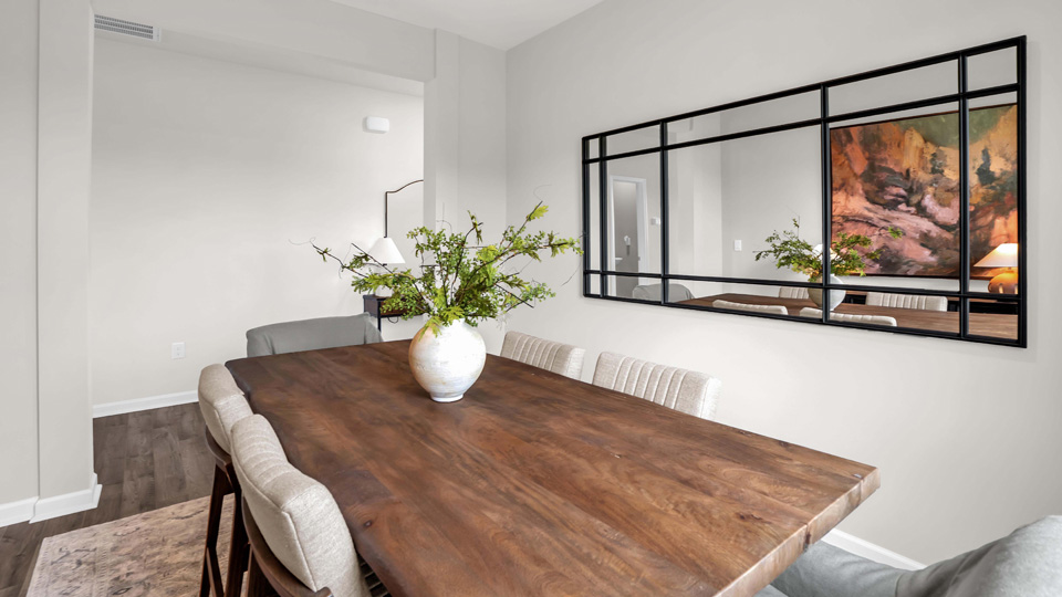 formal dining area with ample lighting and revwood flooring
