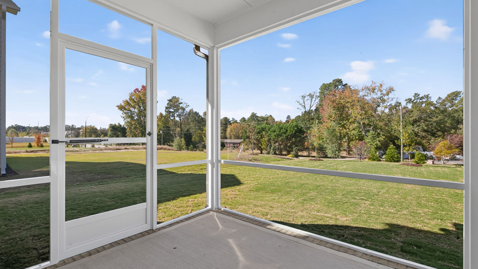 covered and screened in back patio