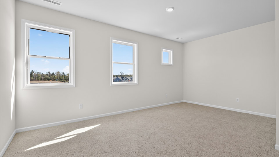 loft with carpet flooring
