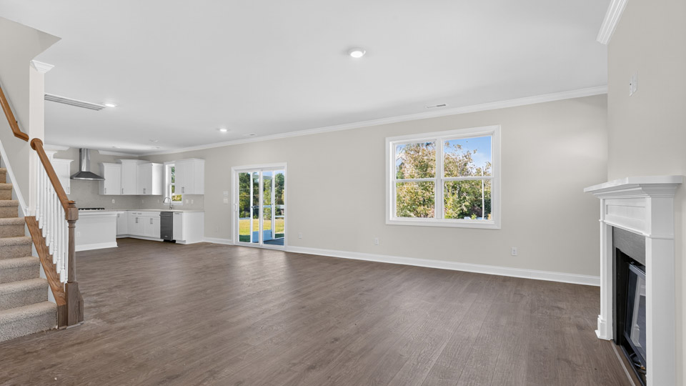 living room with revwood flooring and fireplace